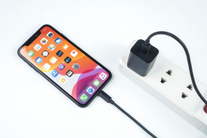 Phone plugged in to a charger.